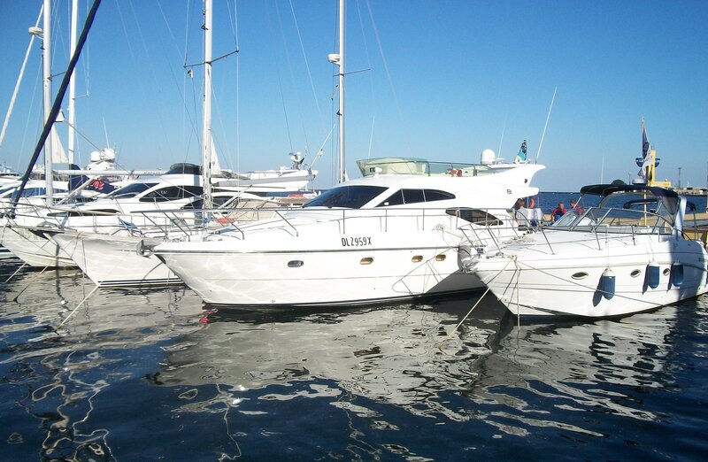 Yachts docked in marina