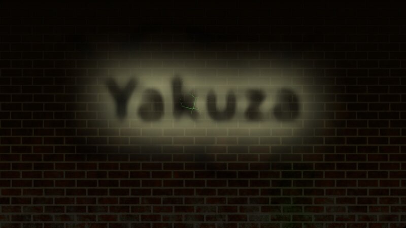 Yakuza text on brick wall
