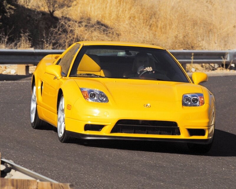 Yellow Acura NSX on a road