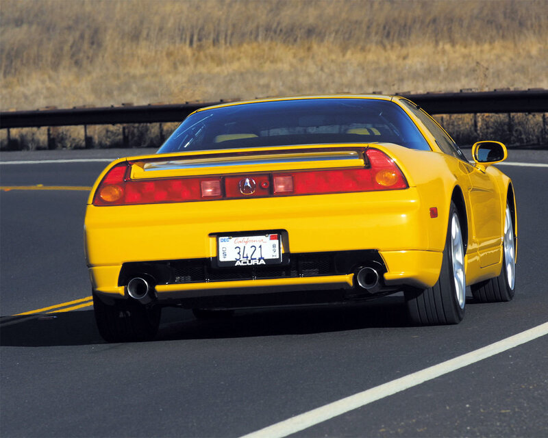 yellow acura nsx on road