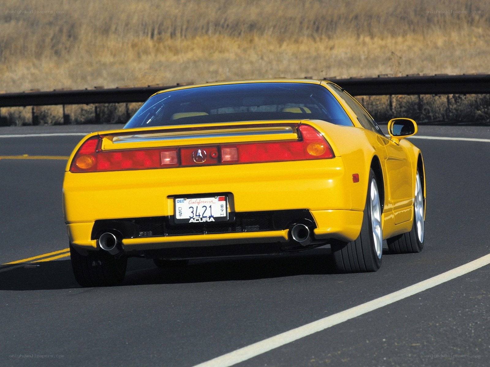 Yellow Acura NSX on road