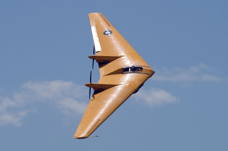 yellow aircraft in flight