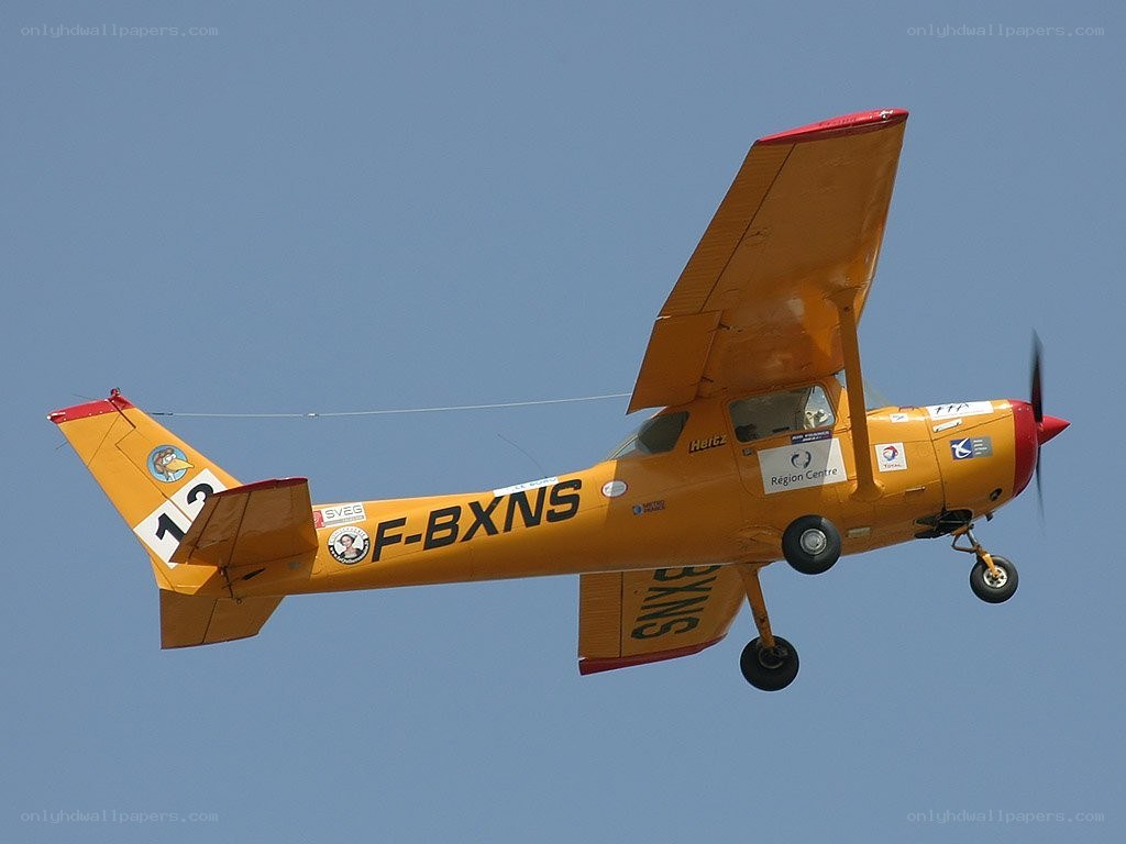 yellow airplane in flight