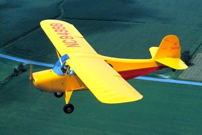Yellow airplane in flight