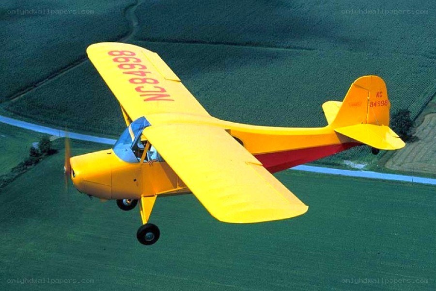 Yellow airplane in flight