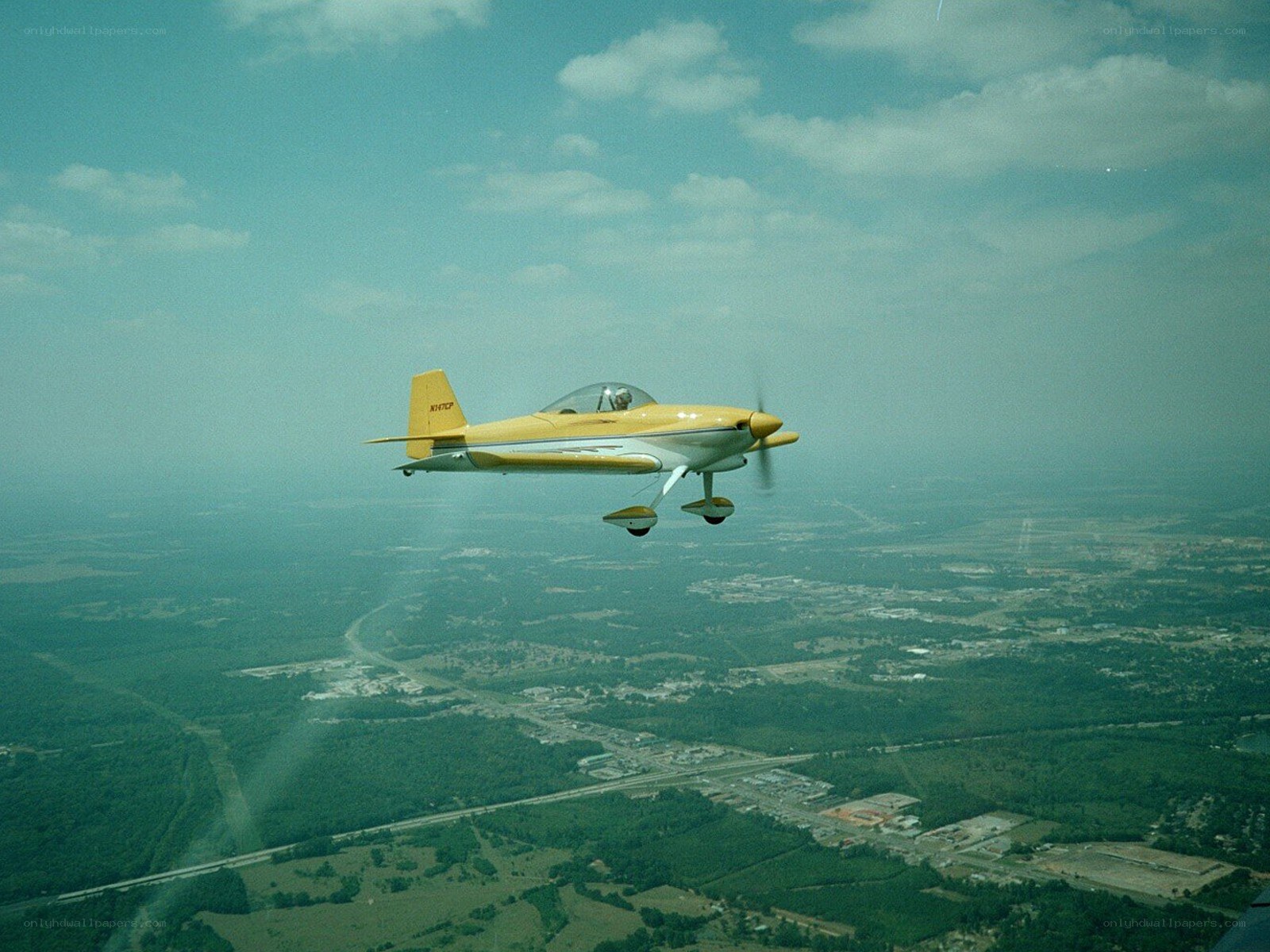 Yellow airplane in flight