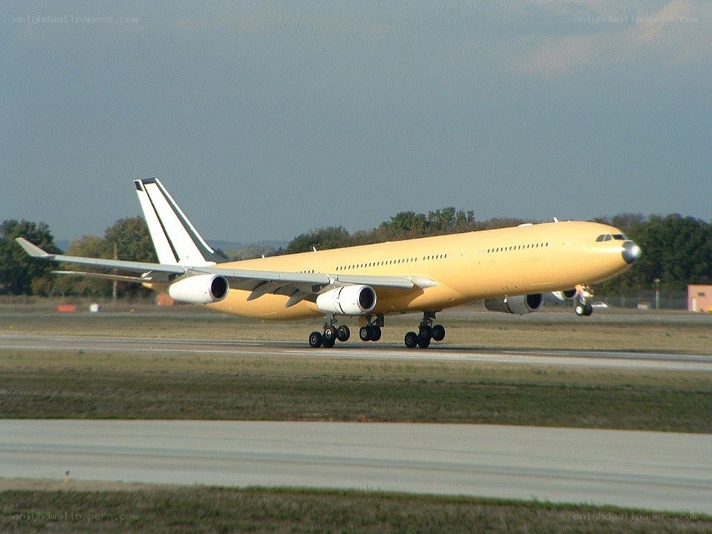 yellow airplane on runway