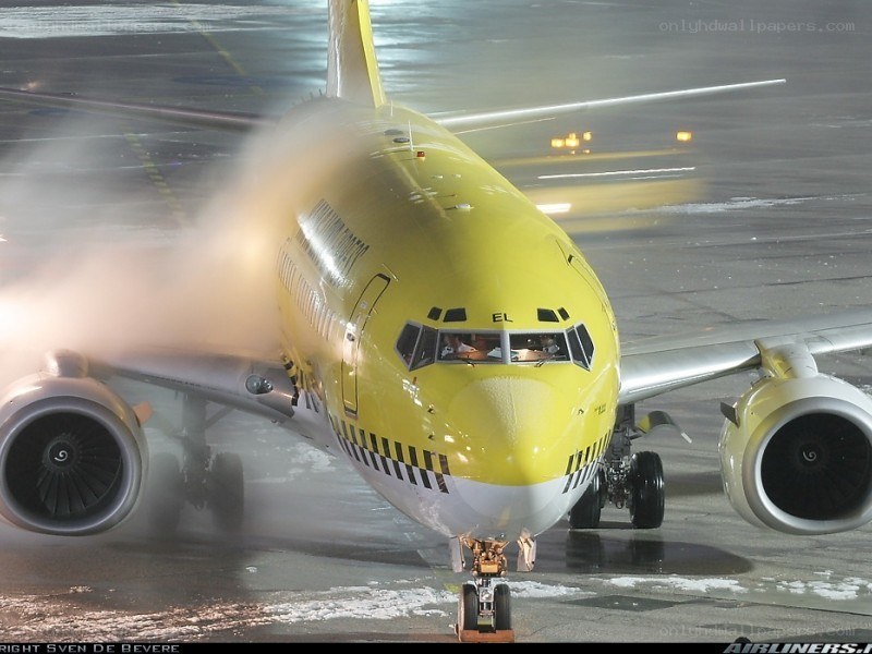 Yellow airplane on tarmac