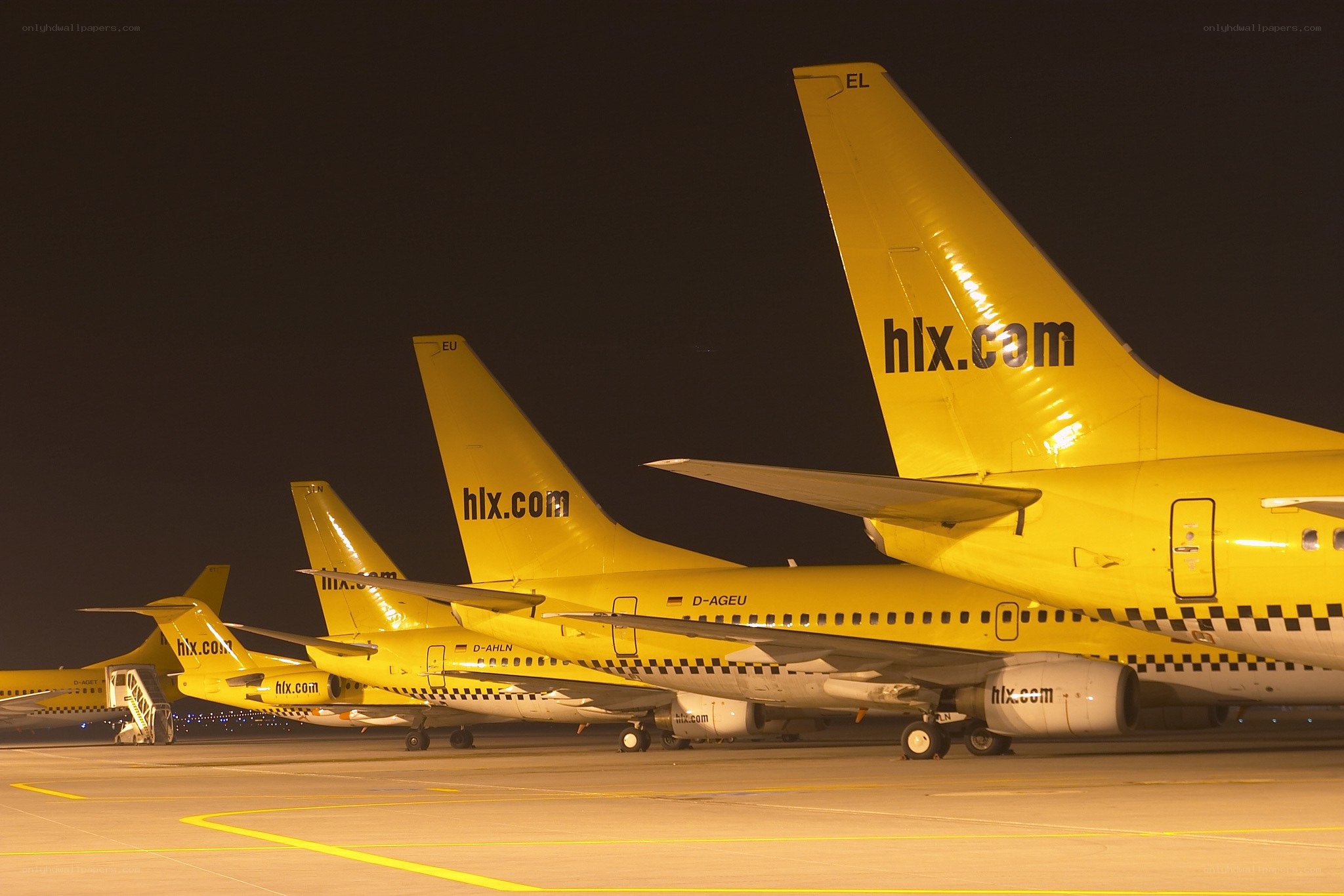 Yellow airplanes at night