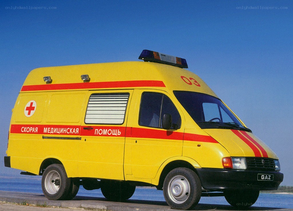 Yellow ambulance on a beach
