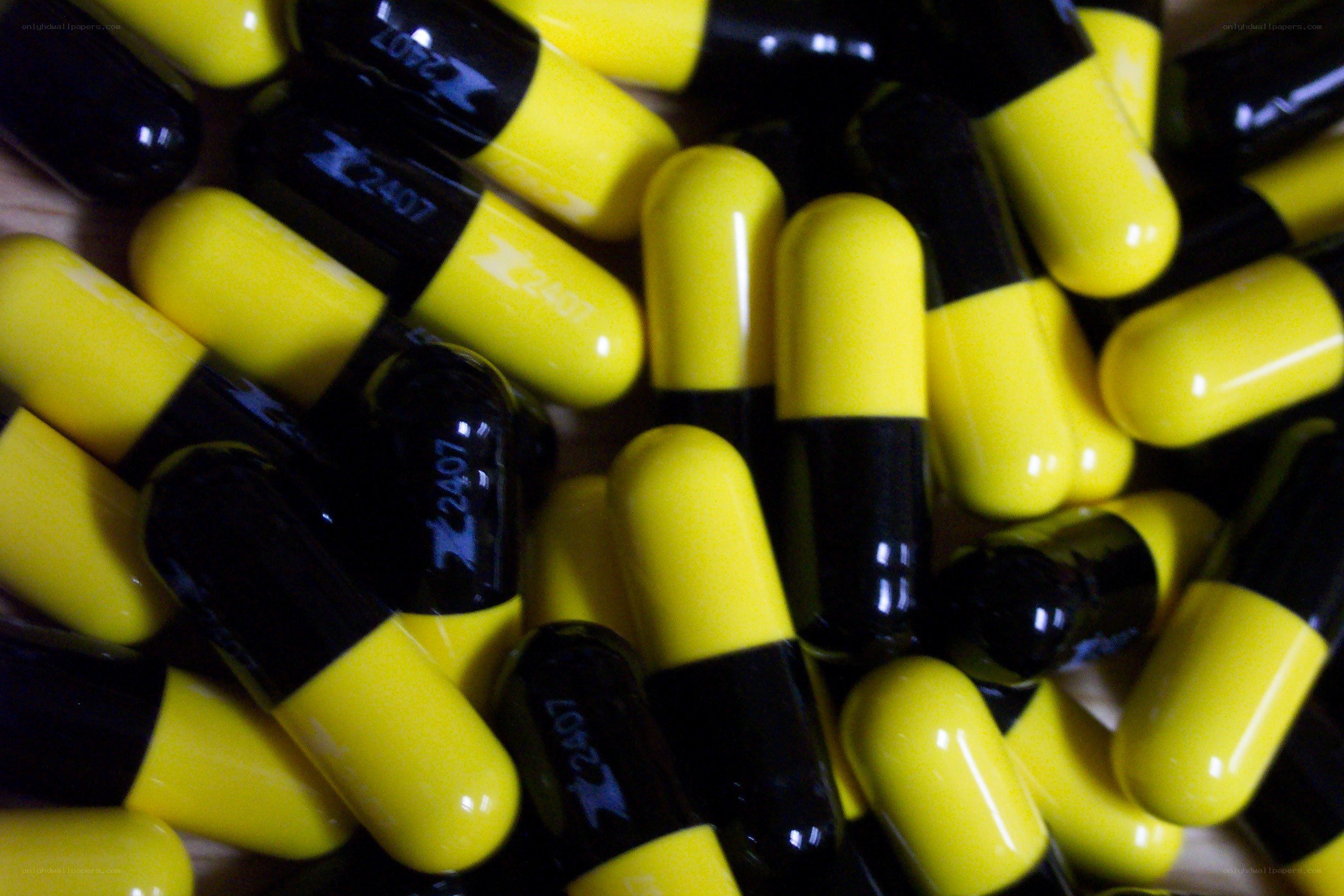 yellow and black capsules