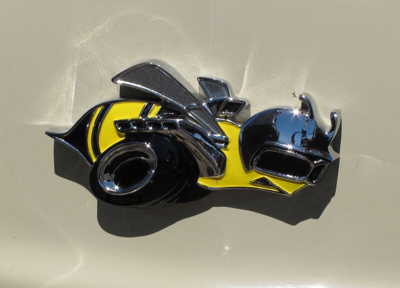 yellow and black car emblem