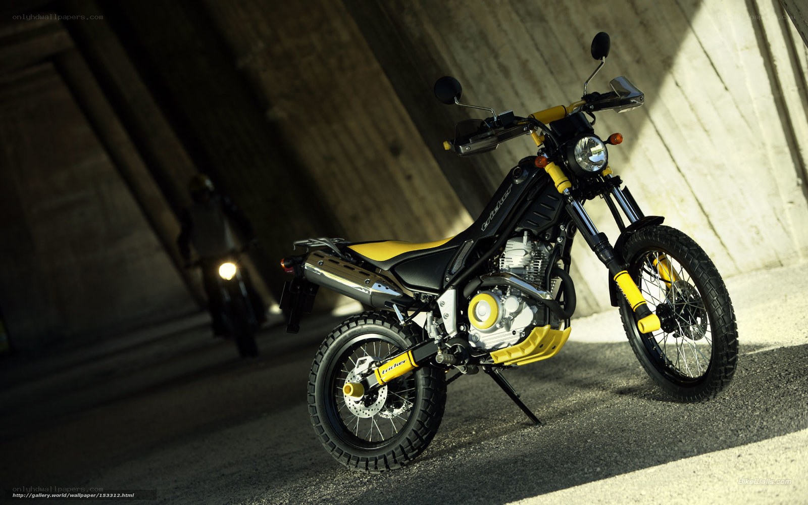 Yellow and black motorcycle in tunnel