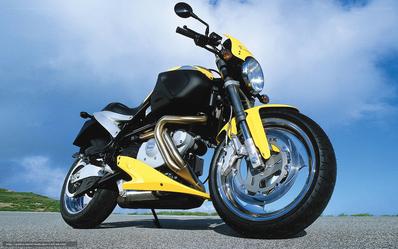 Yellow and black motorcycle on road