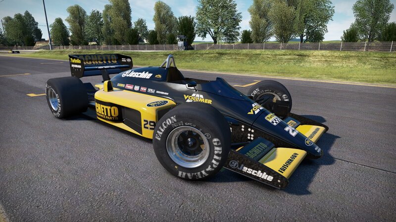 yellow and black race car on track