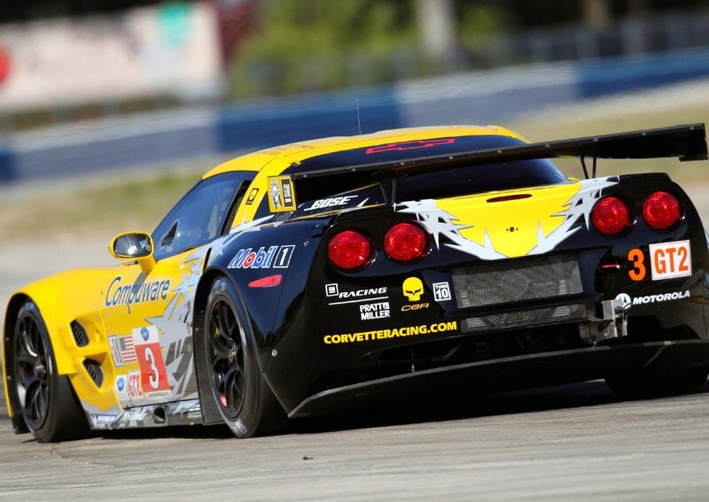 Yellow and black race car on track