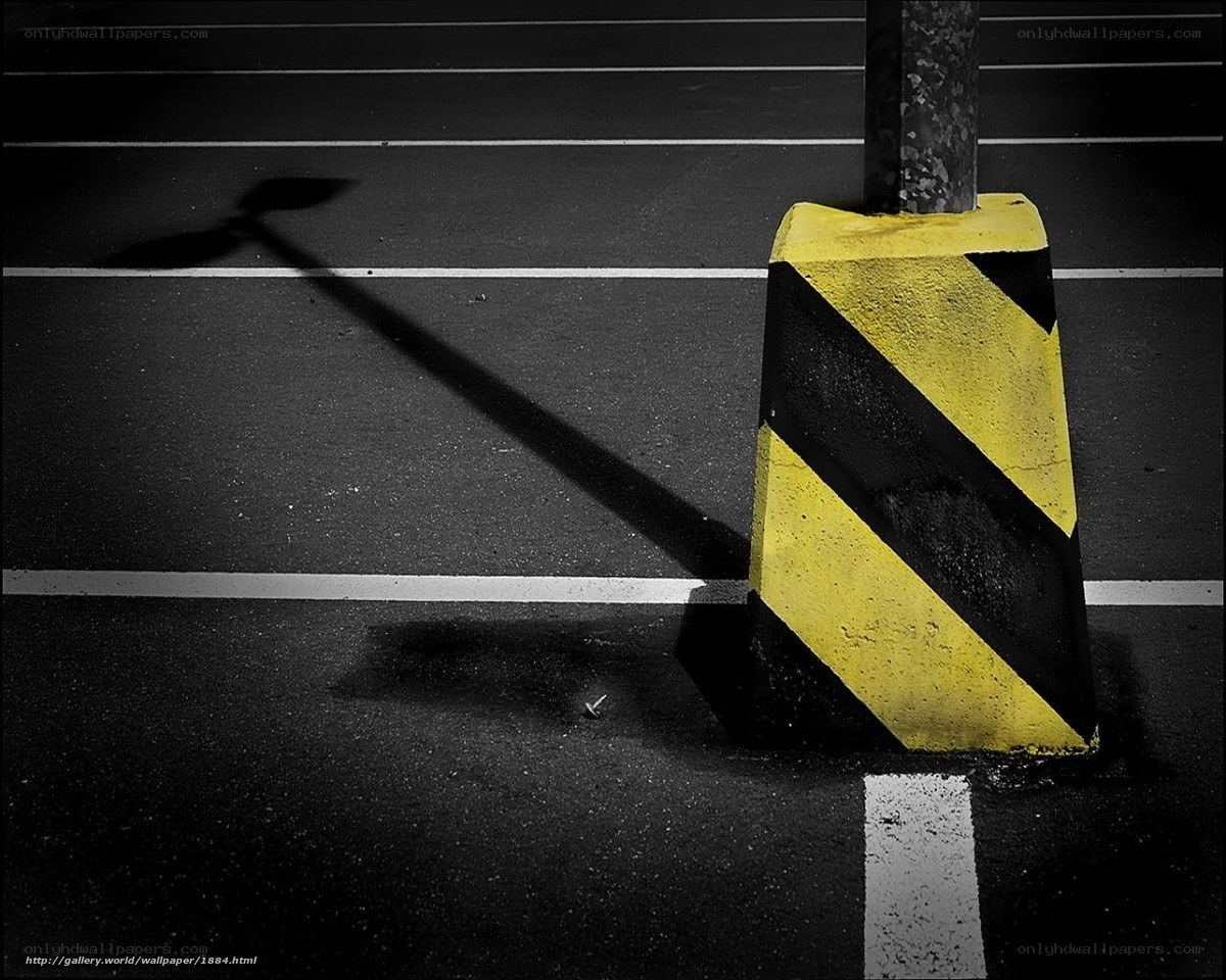 yellow and black striped bollard