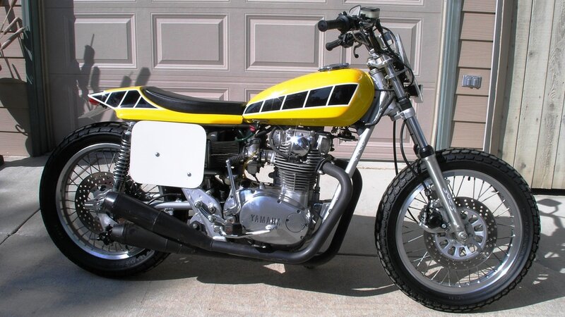 yellow and black Yamaha motorcycle