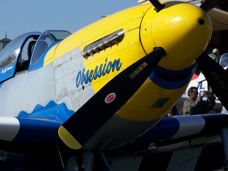 Yellow and blue airplane with 'Obsession' text