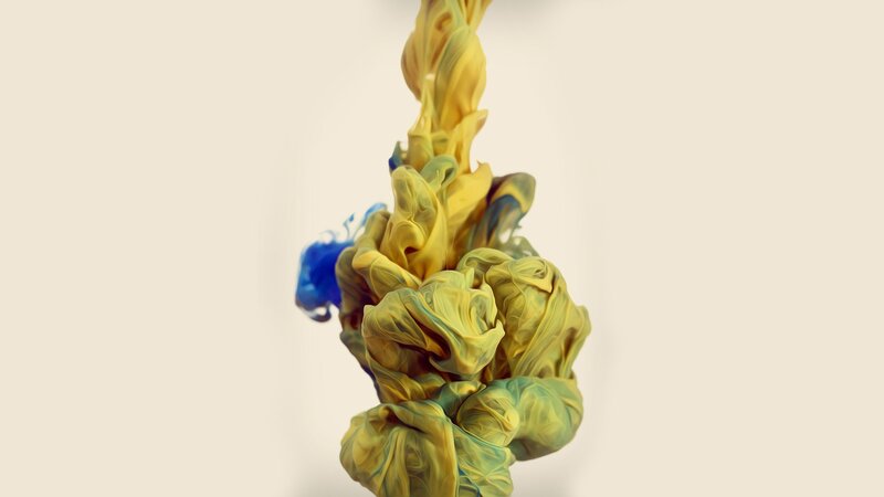 yellow and blue ink swirl