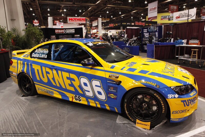 Yellow and blue race car on display