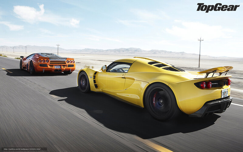 Yellow and orange supercars on desert road