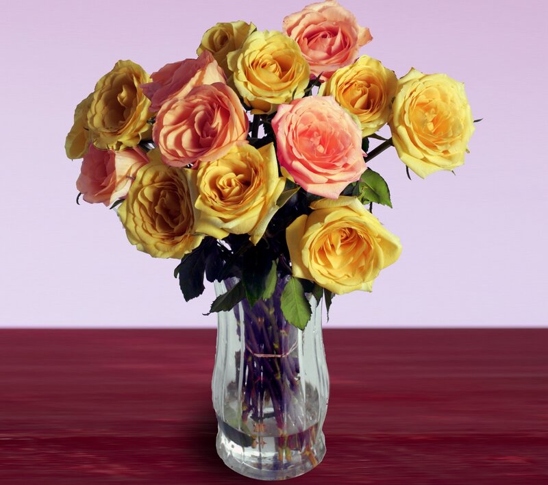 Yellow and pink roses in a vase