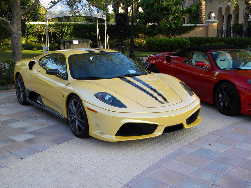 Yellow and red Ferraris parked