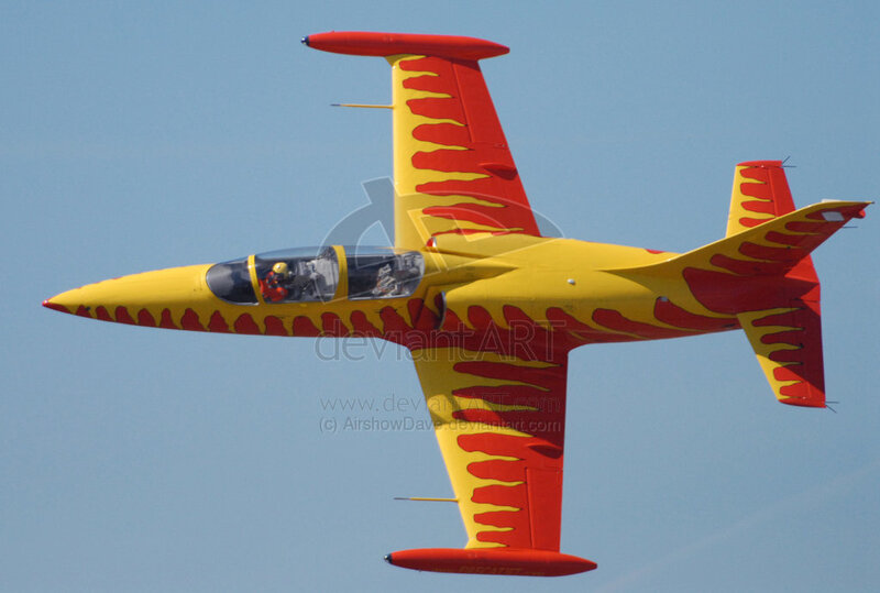 yellow and red jet in flight