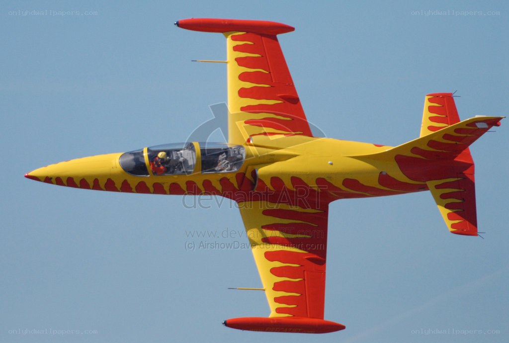 yellow and red jet in flight