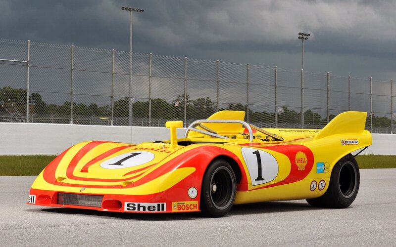 Yellow and red race car on track
