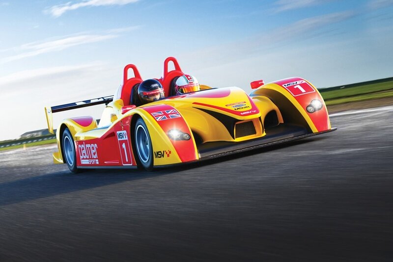 Yellow and red race car on track