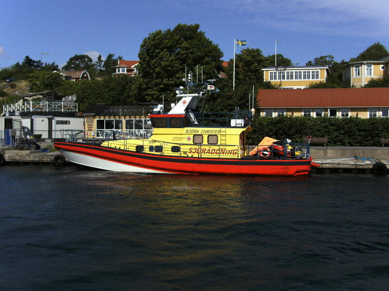 Yellow and red rescue boat at dock