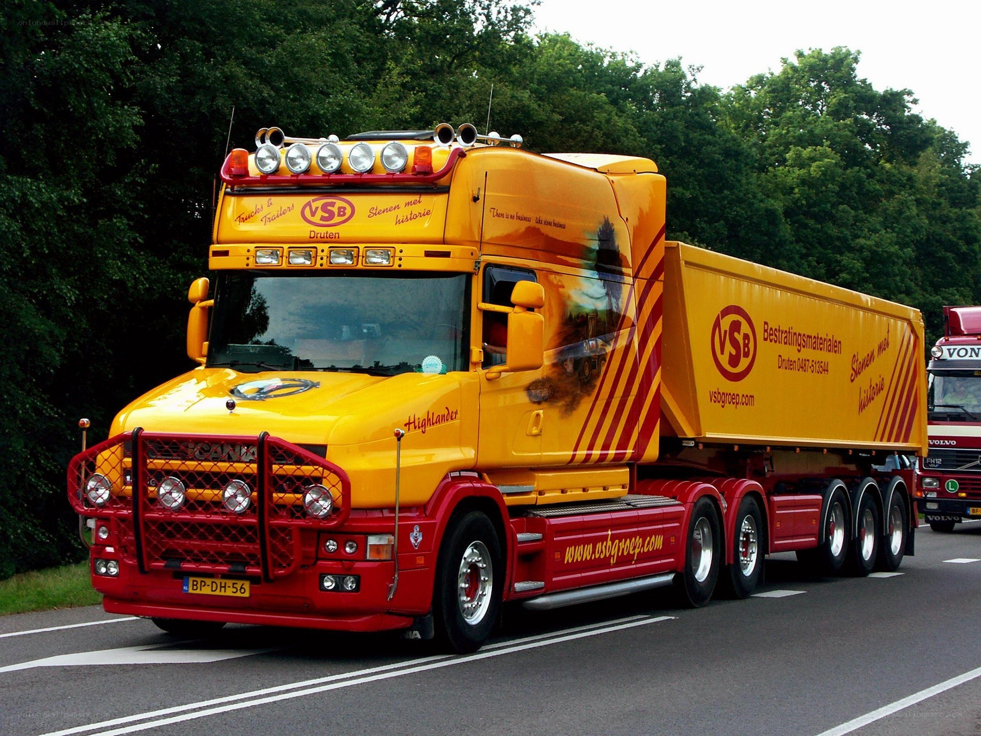 Yellow and red Scania truck