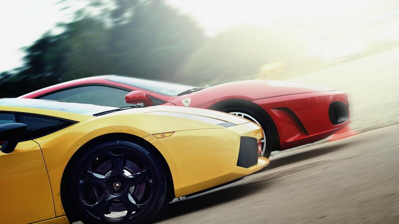 Yellow and red sports cars racing