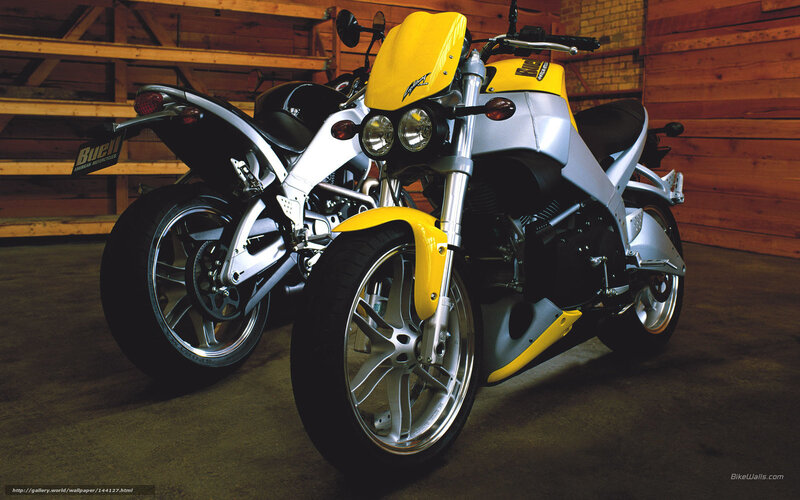 Yellow and silver motorcycles in garage