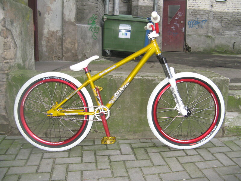 yellow and white BMX bike