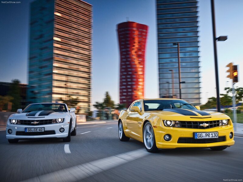 Yellow and white Camaro cars