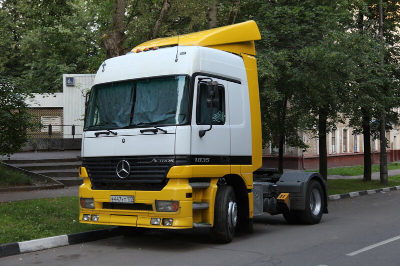 Yellow and white Mercedes-Benz Actros truck