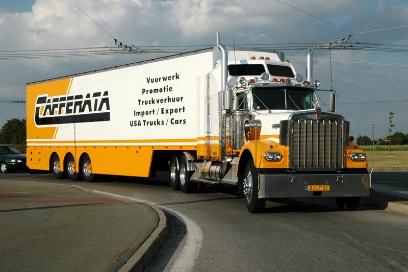 Yellow and white semi-truck on road