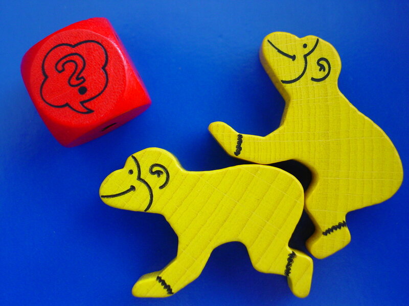 Yellow animal figures and red die