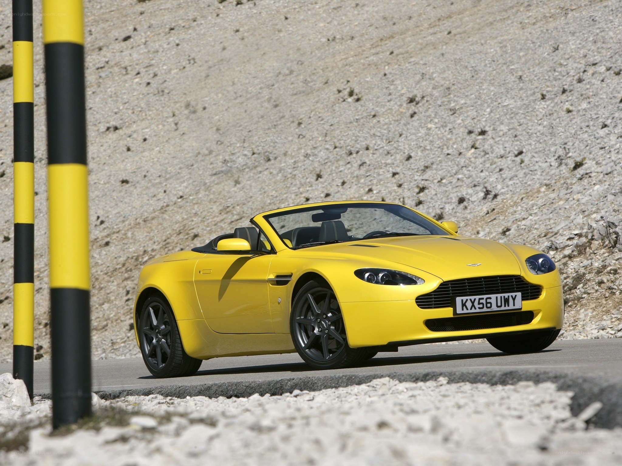 Yellow Aston Martin convertible