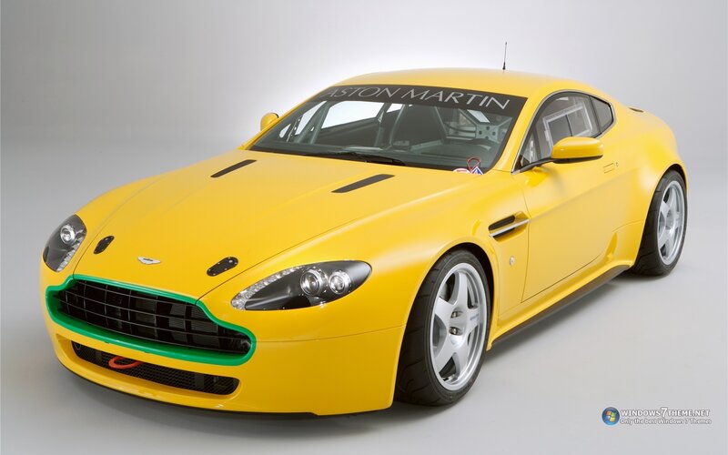 yellow aston martin race car