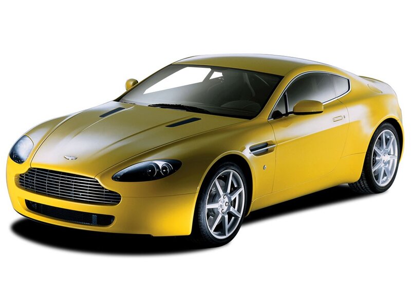 yellow aston martin sports car