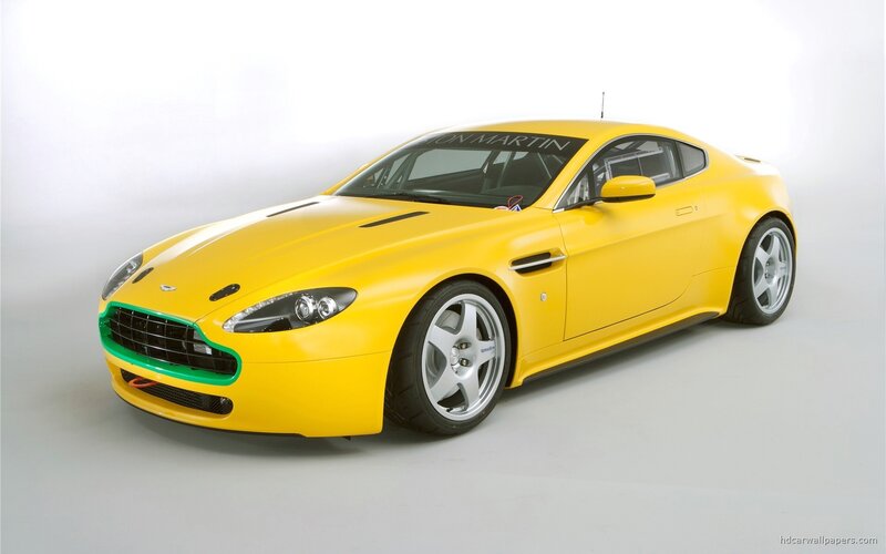 yellow aston martin sports car