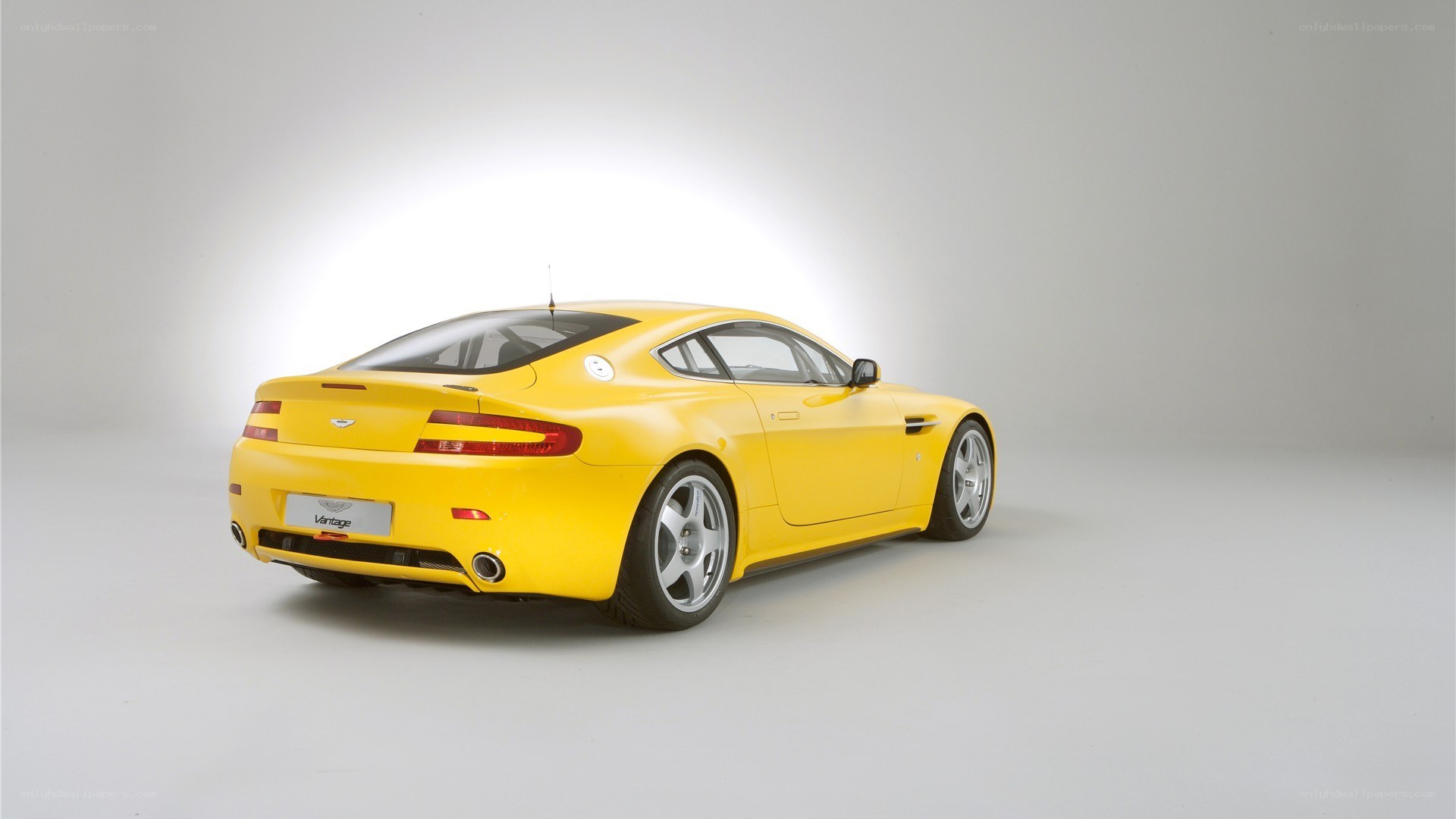 yellow aston martin vantage