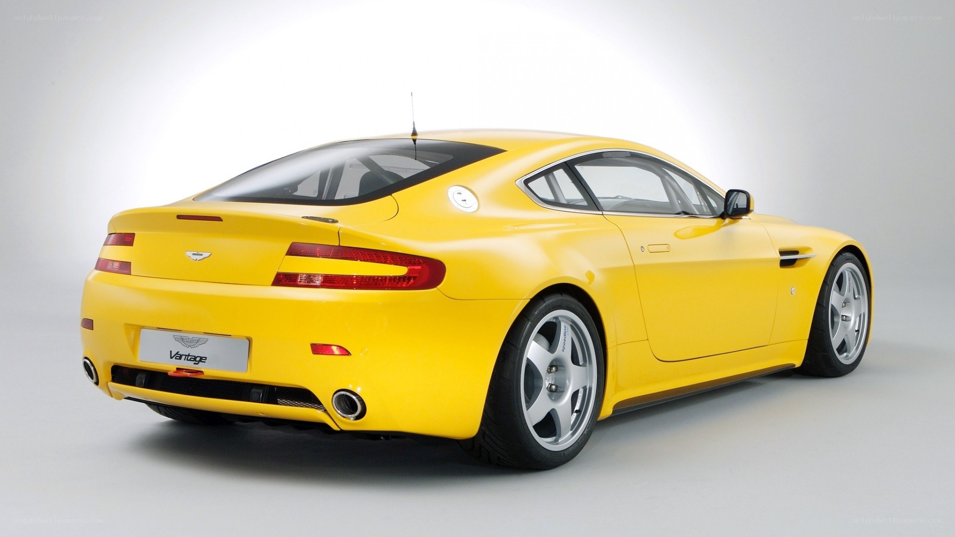 yellow aston martin vantage