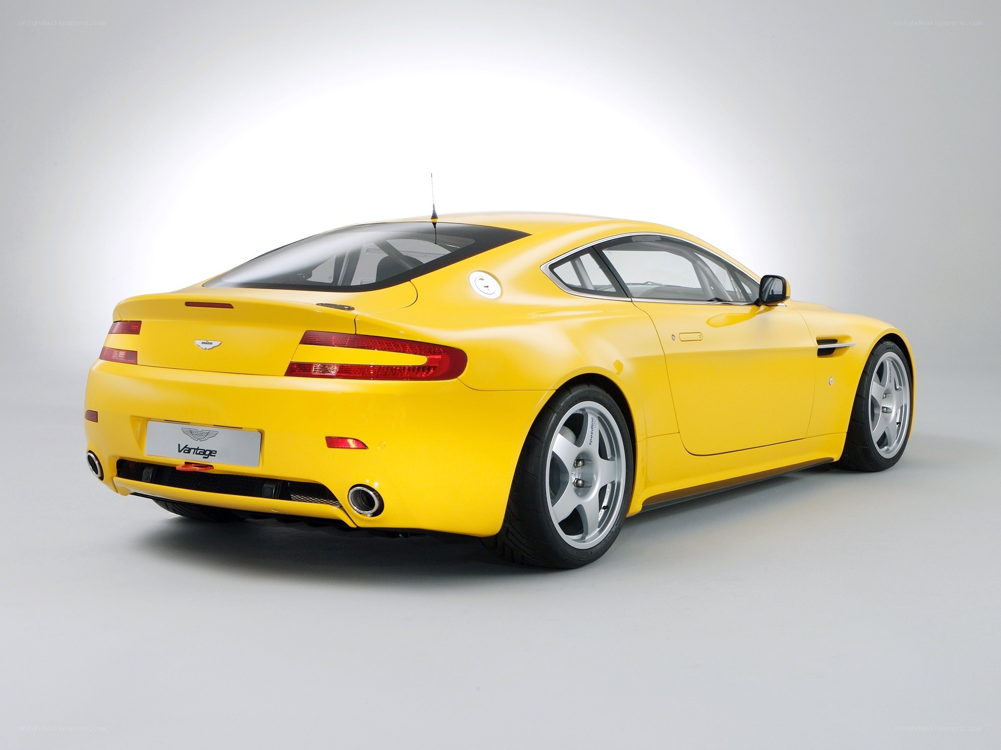 Yellow Aston Martin Vantage