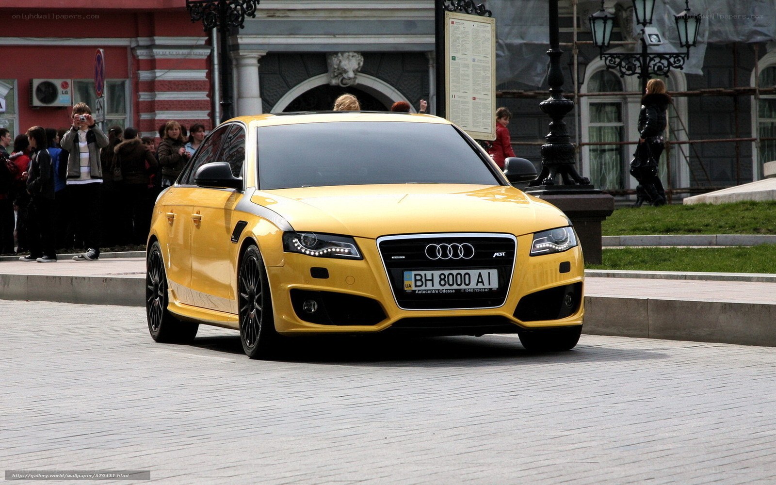 Yellow Audi A4 on city street