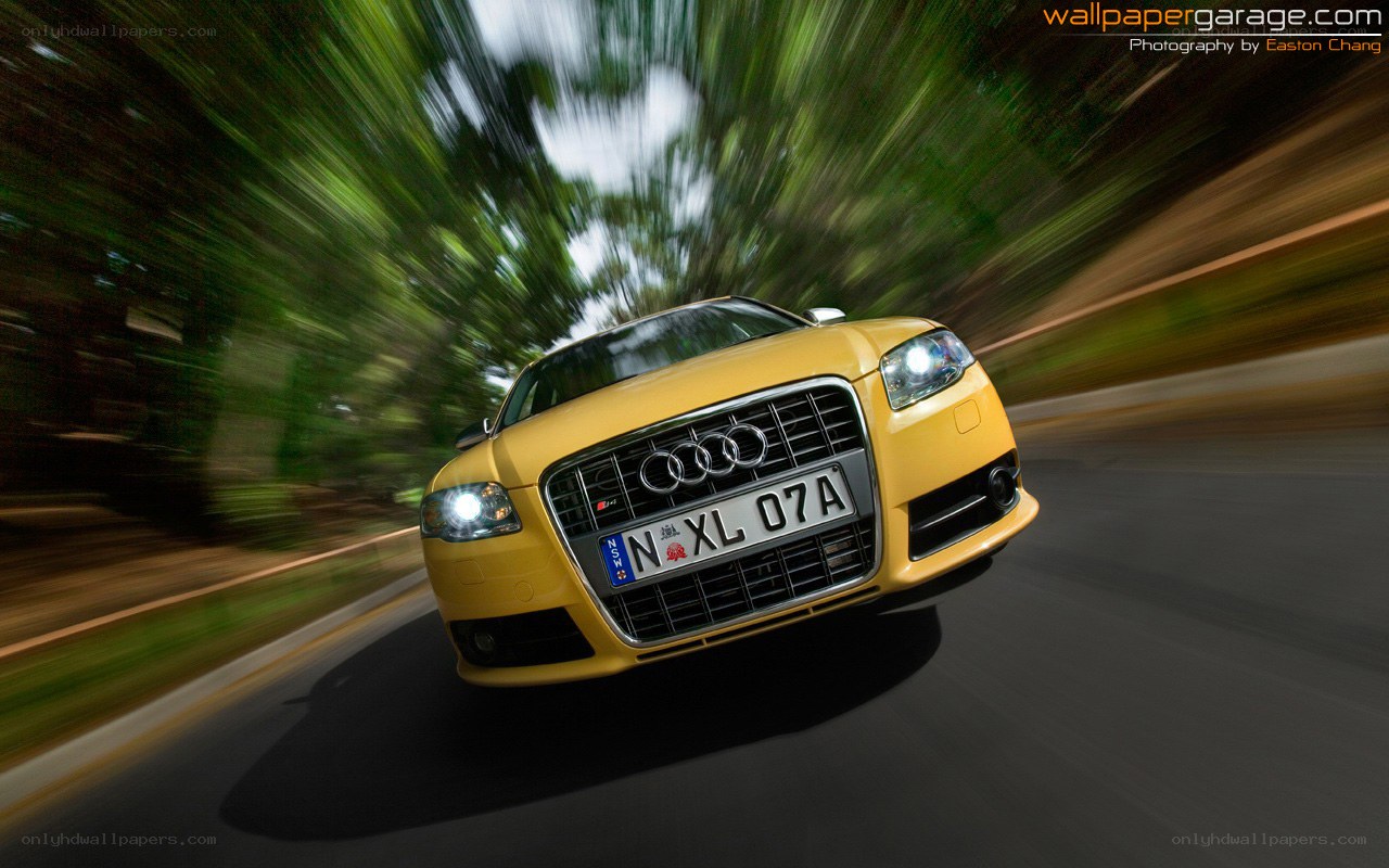 yellow audi in motion